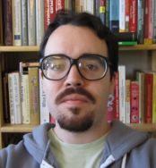 [Photo of Arthur O'Dwyer in front of a bookshelf]